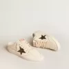 Ball Star Sabots aus elfenbeinfarbenem Nappaleder mit bronzefarbenem Glitzerstern