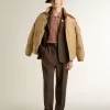 Beige Bomberjacke mit Leder- und Patch-Details