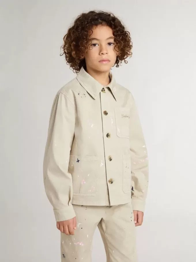Beigefarbene Kinderjacke mit bunten Sprenkeln