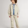 Beigefarbene Kinderjacke mit bunten Sprenkeln