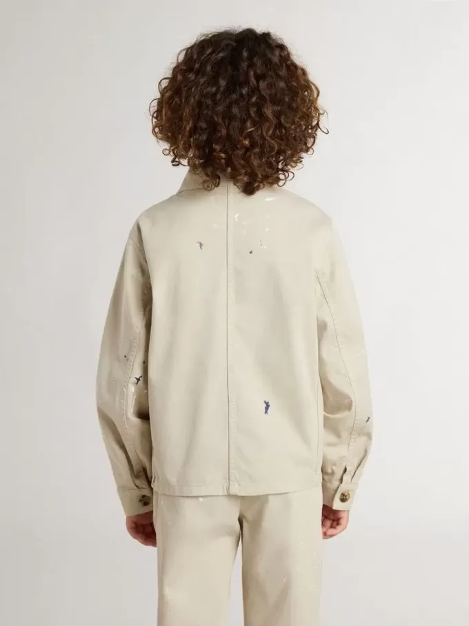 Beigefarbene Kinderjacke mit bunten Sprenkeln