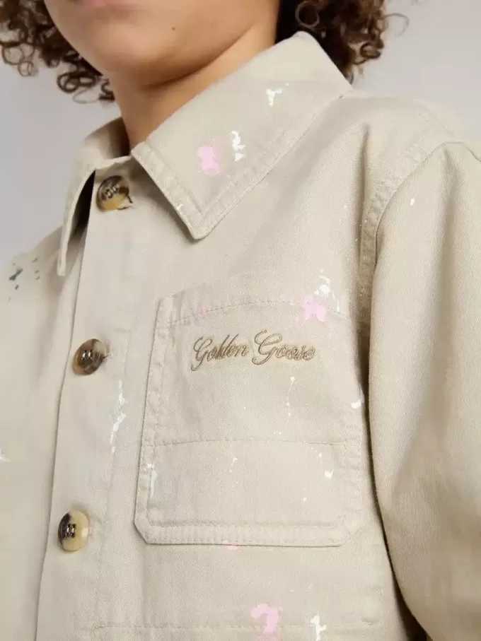 Beigefarbene Kinderjacke mit bunten Sprenkeln
