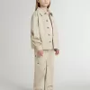 Beigefarbene Kinderjacke mit bunten Sprenkeln