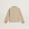 Beigefarbene Kinderjacke mit bunten Sprenkeln