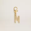 Buchstabe M-Anhänger aus goldfarbenem Messing mit Kristallen Buchstabe M-Anhänger aus goldfarbenem Messing mit Kristallen
