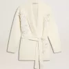 Cremefarbene Damenstrickjacke aus Baumwolle mit Blumenstickerei