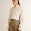 Cremefarbenes, kurz geschnittenes Sweatshirt für Damen aus Baumwolle mit Kristallen auf der Vorderseite
