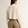 Cremefarbenes, kurz geschnittenes Sweatshirt für Damen aus Baumwolle mit Kristallen auf der Vorderseite