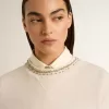 Cremefarbenes, kurz geschnittenes Sweatshirt für Damen aus Baumwolle mit Kristallen auf der Vorderseite