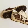Damen-Sneaker „Ball Star” in Glitzeroptik mit Lederstern und metallischer Lederlasche am Fersenbereich Damen-Sneaker „Ball Star” in Glitzeroptik mit Lederstern und metallischer Lederlasche am Fersenbereich
