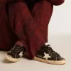 Damen-Superstar in schwarzem Glitzer und Nappa mit cremefarbenem Lederstern und Fersenlasche Damen-Superstar in schwarzem Glitzer und Nappa mit cremefarbenem Lederstern und Fersenlasche