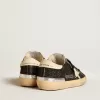 Damen-Superstar in schwarzem Glitzer und Nappa mit cremefarbenem Lederstern und Fersenlasche Damen-Superstar in schwarzem Glitzer und Nappa mit cremefarbenem Lederstern und Fersenlasche