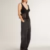 Damenjeans aus schwarzem Baumwollstoff im Distressed-Look mit Patches auf der Vorderseite