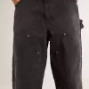 Damenjeans aus schwarzem Baumwollstoff im Distressed-Look mit Patches auf der Vorderseite