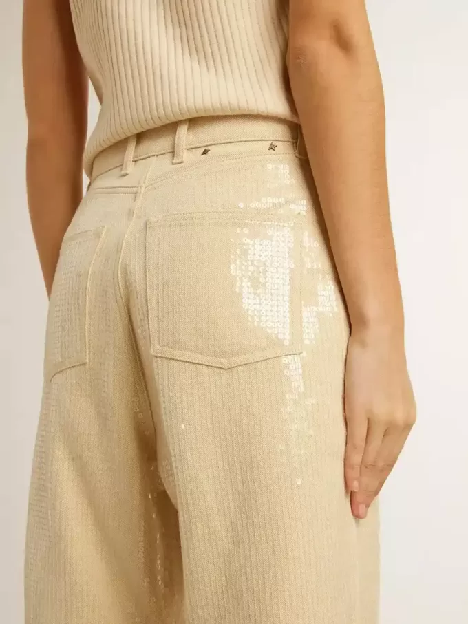 Ecrufarbene Hose mit transparenten Pailletten