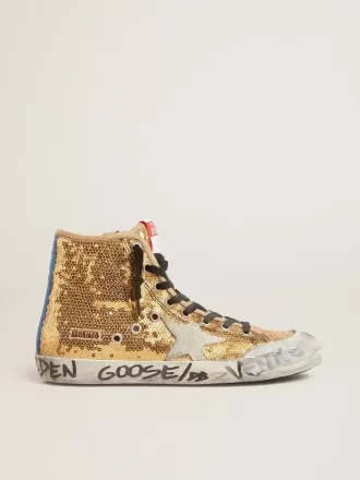 Francy Penstar in Goldpailletten mit Wildlederstern und leuchtend blauer Fersenlasche