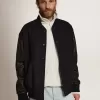 Herren-Bomberjacke aus dunkelblauer Wolle mit Lederärmeln Herren-Bomberjacke aus dunkelblauer Wolle mit Lederärmeln