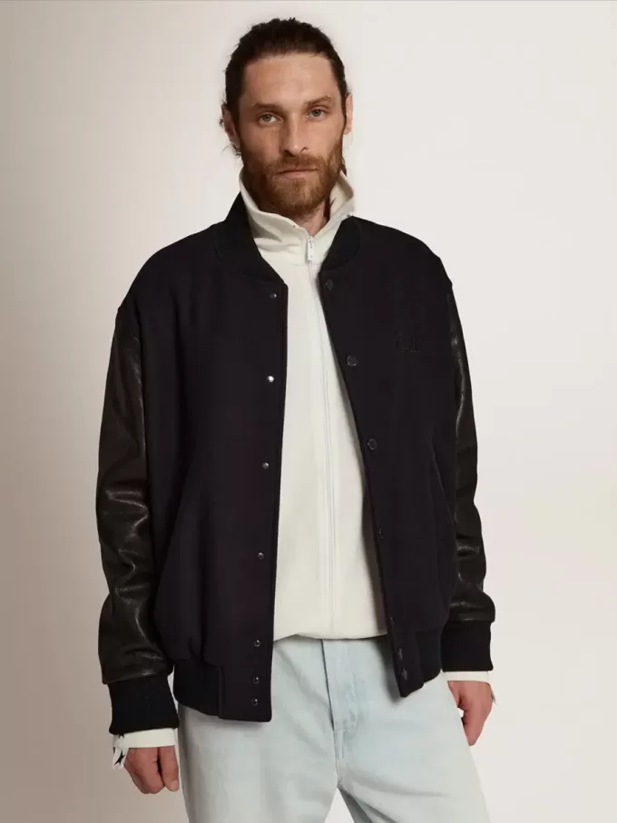 Herren-Bomberjacke aus dunkelblauer Wolle mit Lederärmeln Herren-Bomberjacke aus dunkelblauer Wolle mit Lederärmeln