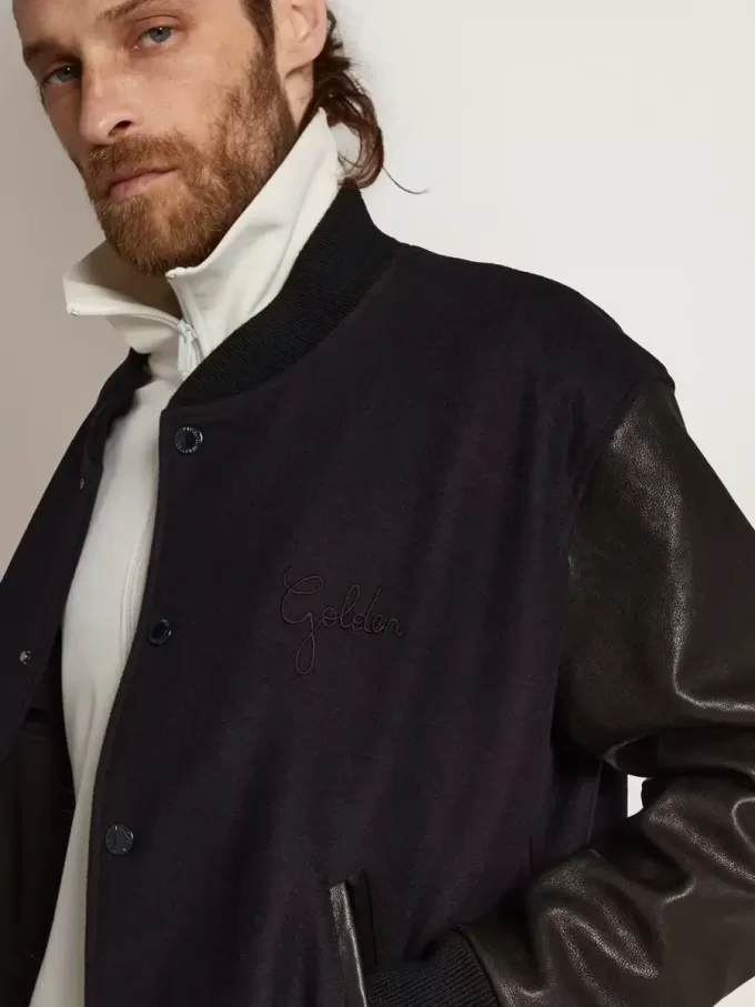 Herren-Bomberjacke aus dunkelblauer Wolle mit Lederärmeln Herren-Bomberjacke aus dunkelblauer Wolle mit Lederärmeln
