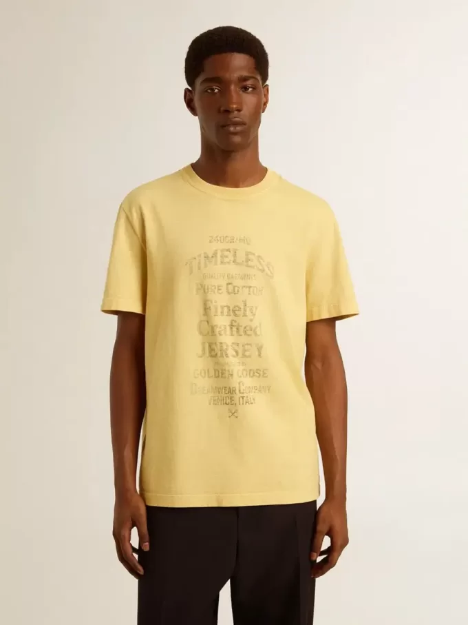 Herren-T-Shirt aus Baumwolle in Hellgelb mit verblasstem Schriftzug