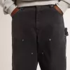 Herrenjeans aus schwarzem Baumwollstoff im Distressed-Look mit Aufnähern auf der Vorderseite