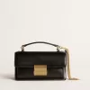 Kleine Venezia-Tasche aus schwarzem Leder mit Golddetails