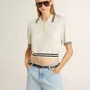 Kurz geschnittenes, weißes Baumwoll-Poloshirt für Damen mit blauen Rippbündchen Kurz geschnittenes, weißes Baumwoll-Poloshirt für Damen mit blauen Rippbündchen