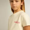 Mädchen-T-Shirt aus Baumwolle in Used-Weiß mit roter Stickerei auf der Brust