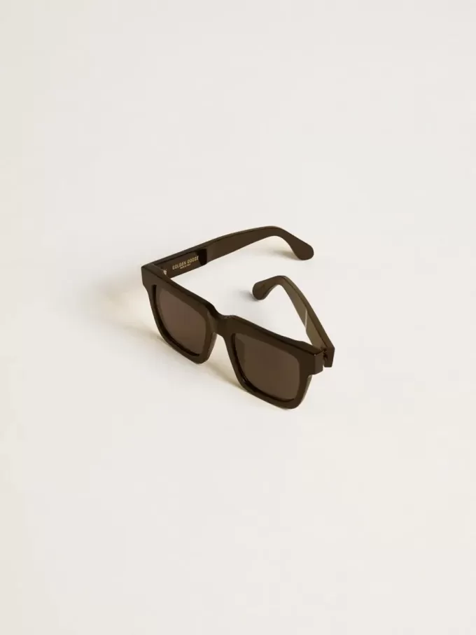 Quadratische Jamie-Sonnenbrille mit schwarzem Rahmen und goldenem Logo