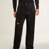 Schwarze Herrenjeans mit lockerer Passform und Kristallen mit Farbverlaufseffekt