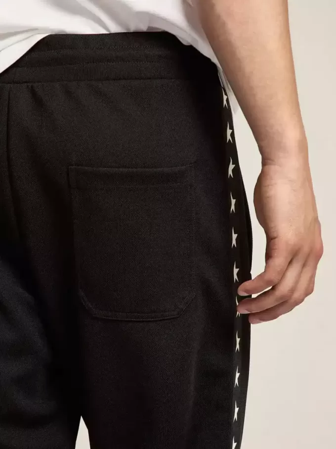 Schwarze Jogginghose für Herren mit weißen Sternen an den Seiten