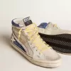 Slide aus perlfarbenem Canvas und blauem Wildleder mit weißem Lederstern und Blitz