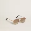 Sonnenbrille im Pilotenstil mit goldenem Rahmen und beigen Gläsern Sonnenbrille im Pilotenstil mit goldenem Rahmen und beigen Gläsern