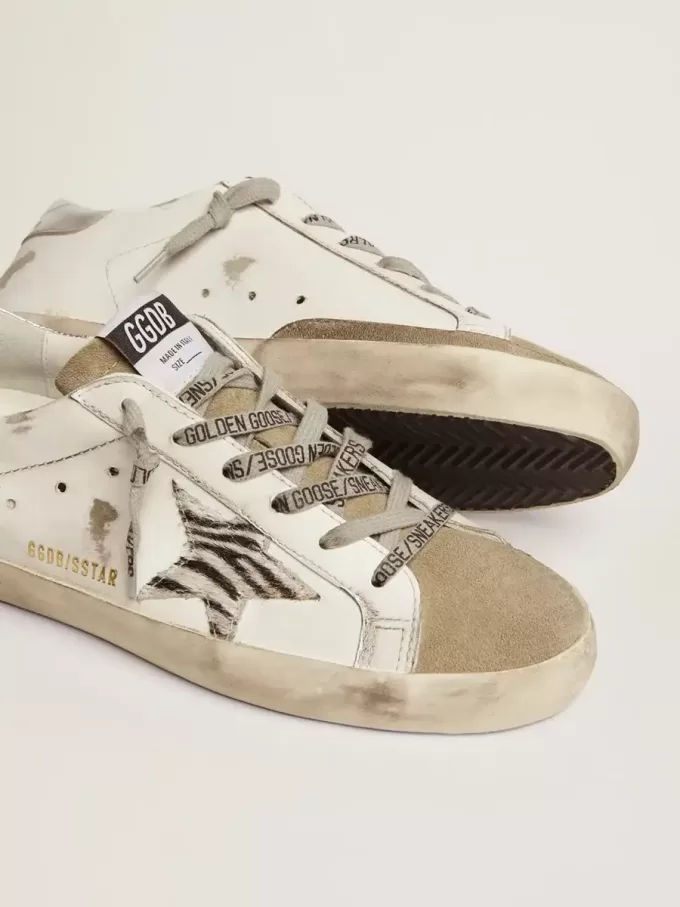 Super-Star für Damen mit Zebra-Print und Ponyfell-Stern Super-Star für Damen mit Zebra-Print und Ponyfell-Stern