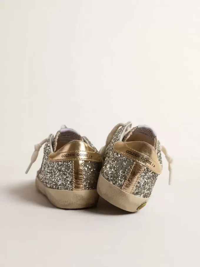 Super-Star Junior in Glitzeroptik mit Stern aus Wildleder und goldener Fersenlasche