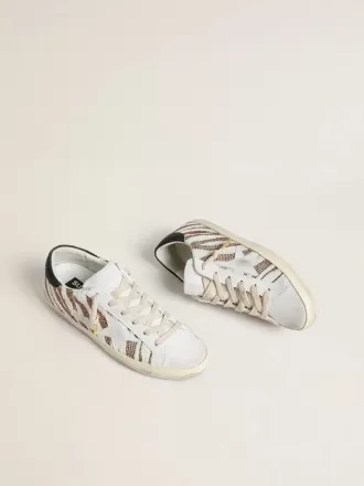 Super-Star LTD für Damen aus weißem Ponyfell mit braunem Glitzer und weißem Wildlederstern Super-Star LTD für Damen aus weißem Ponyfell mit braunem Glitzer und weißem Wildlederstern