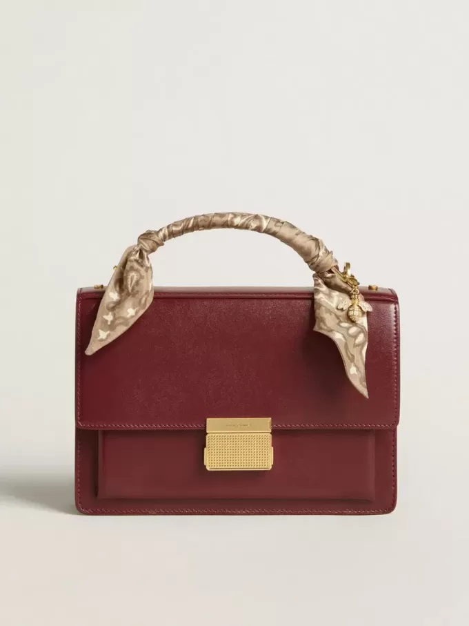 Venezia Tasche aus burgunderrotem Leder mit Golddetails