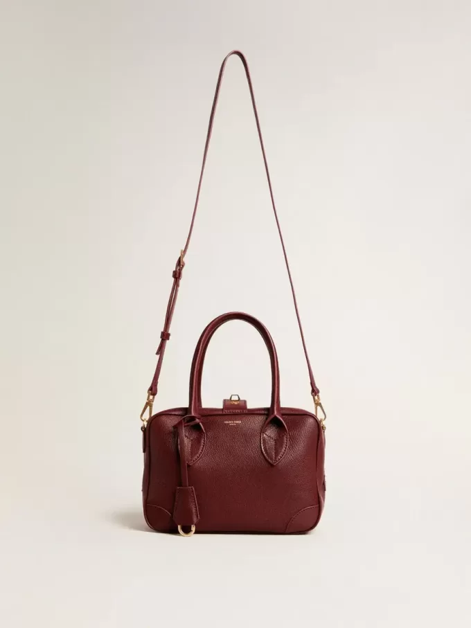 Vita Bag aus burgunderrotem Leder mit goldenen Details