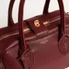 Vita Bag aus burgunderrotem Leder mit goldenen Details