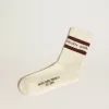 Weiß getrunkene Socken mit Used-Details und braunen Streifen