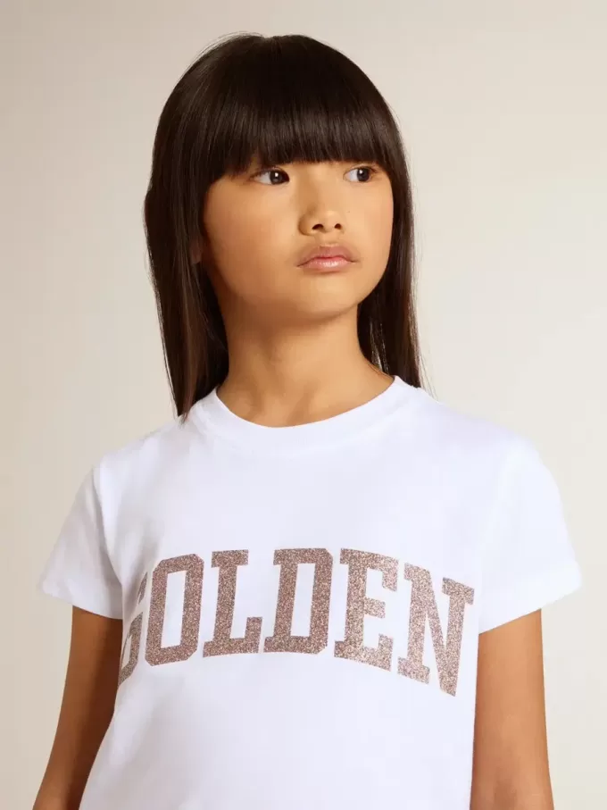 Weißes T-Shirt für Mädchen mit rosa Glitzer und goldener Schrift Weißes T-Shirt für Mädchen mit rosa Glitzer und goldener Schrift