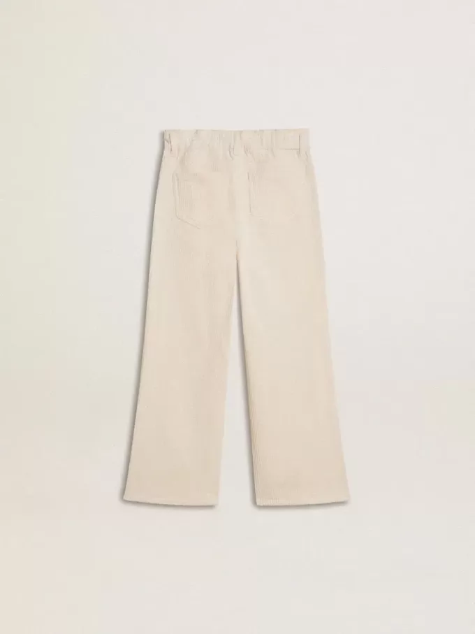 Weite, cremefarbene Mädchenhose mit Rippstrick und Stickerei