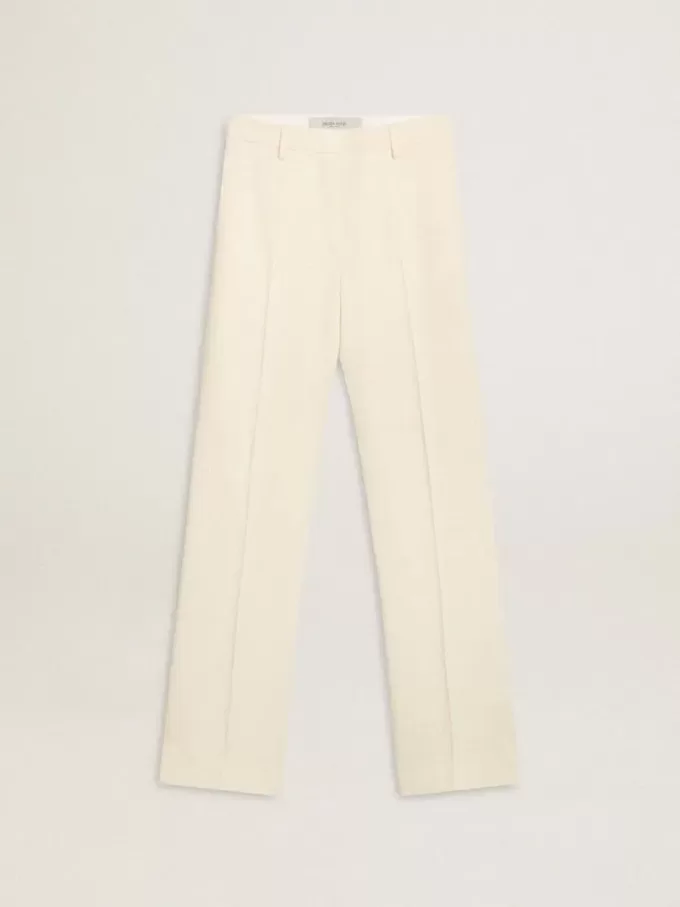 Weite Damenhose aus abgenutztem, weißem Stoff